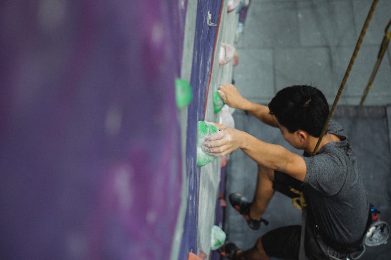 Overhead view of climbers on an indoor bouldering wall